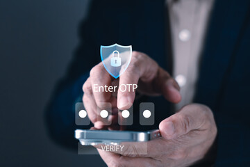 Businessman using smartphone to enter OTP for secure login with two-factor authentication verification system