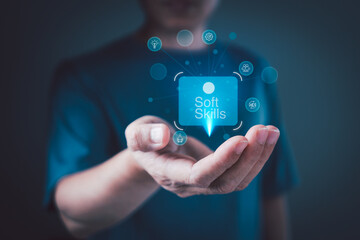 Soft skills development concept with human hand holding digital icon representing communication, teamwork, leadership, emotional intelligence, and adaptability