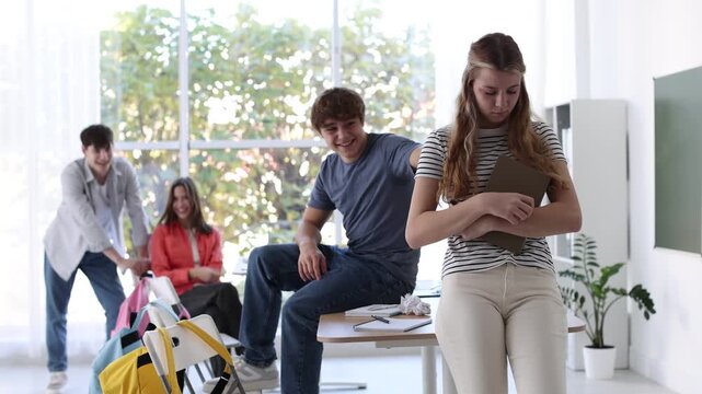 Students bullying their classmate in classroom, selective focus