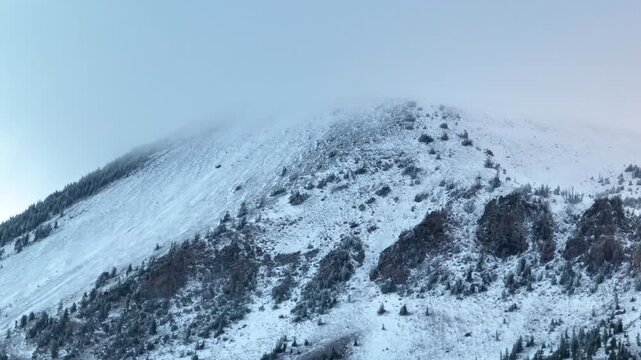 Aerial Snow Covered Mountain Ridge Mammoth California Winter Flyover