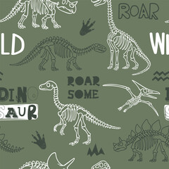 Naklejka premium Seamless pattern for t-shirts with colourful drawing dinosaur skeletons. Print design for boy on green background. Grunge style vector