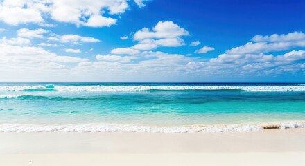 Fototapeta premium Vibrant turquoise ocean waves gently rolling onto a pristine white sand beach under a bright blue sky with scattered white clouds, creating a perfect tropical seascape