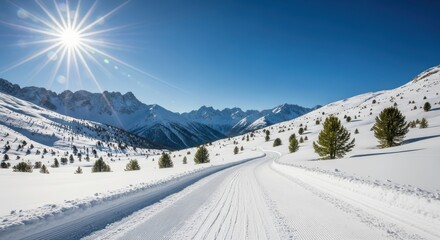 Wintry mountain landscape with a snowcovered road leading through rolling hills under a bright, shining sun and clear blue sky, suggesting a cold but sunny day in the alpine region