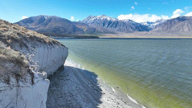 Aerial Crowley Lake Sierra Nevada Tufa Cliff and Water Flyover