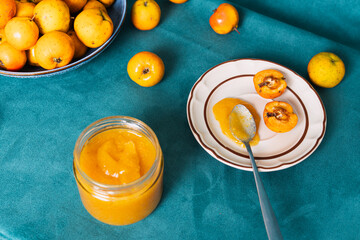 Homemade quince paste jam with fresh fruit on table