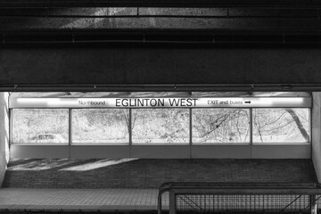 Fototapeta premium black and white representation, interior sign of Eglinton West subway station, line 1, Toronto