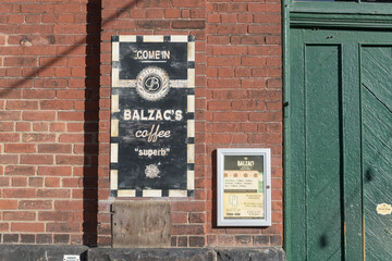 Fototapeta premium sign outside Balzac's Distillery District, a cafe, located at 1 Trinity St, Toronto