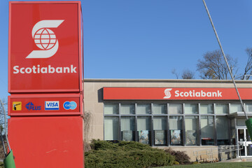 Fototapeta premium exterior location marker and building facade with sign of Scotiabank branch location at 1151 Weston Rd, Toronto