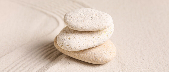 Stack of stones on sand with lines. Zen concept © Pixel-Shot