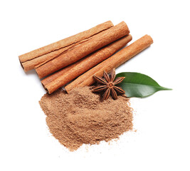 Powder with cinnamon sticks, anise and leaf on white background