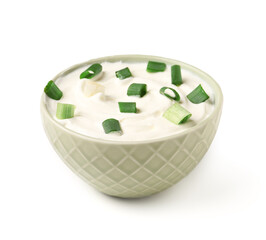 Bowl of tasty sour cream with green onion on white background