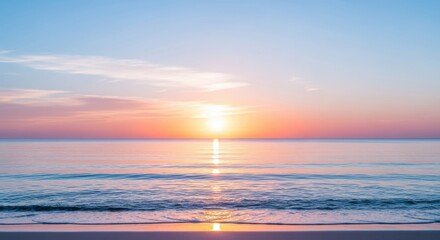 Naklejka premium Serene ocean sunrise with vibrant orange and pink hues reflecting on calm water surface above a sandy beach