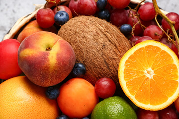Bowl with different fresh fruits, closeup
