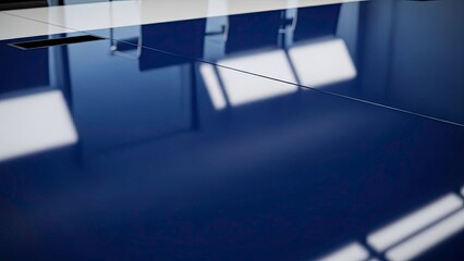 Abstract closeup of a highly reflective, glossy dark blue surface showing chair and window light reflections in a modern interior