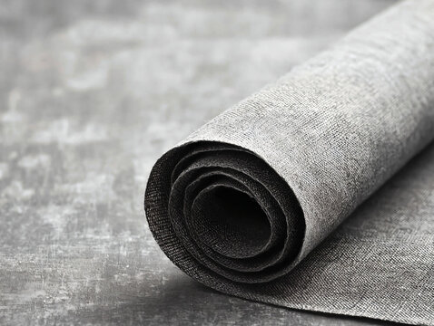 Elegant Gray Fabric Roll on Textured Background for Fashion Design