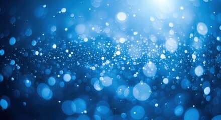 Blue bokeh lights on a dark background.