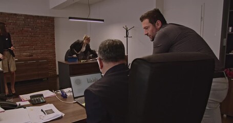 Business professionals of different ages collaborate on a project, analyzing data and strategizing in a modern office environment. - Powered by Adobe