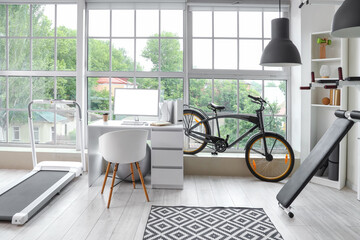 Naklejka premium Interior of gym with modern sports equipment