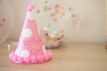 Celebrating a special birthday with a pink party hat