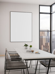 Blank frame on wall and white table in living room or dining room with city view outside the window.