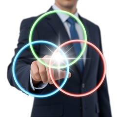 Fototapeta premium A businessman in a suit interacting with overlapping, glowing circles of red, green, and blue that converge in the center with a bright flash to highlight intersections and connections for future