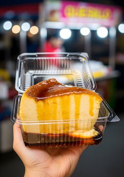 Hand Holding Quesillo Flan Dessert in Plastic Container at Night Market