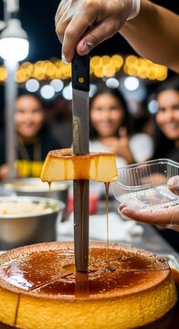 Vendor Cutting Slice of Quesillo Flan with Dripping Caramel at Night Market