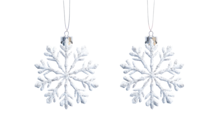 Two white snowflake ornaments isolated on transparent background