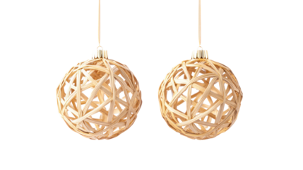 Pair of traditional handmade straw ornaments overhead side by side on transparent background