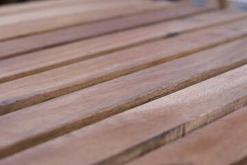 Natural brown wood plank texture in close up background view. detailed wooden surface pattern offers warm, calm, rustic, and organic feel for serene design project