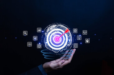 Business goal setting concept. Businessman holding virtual target icon for business purpose. Strategic planning for business growth. Marketing strategy and goal for success.