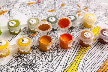 Paints on unfinished canvas for painting by numbers, closeup