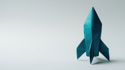 Origami Rocket Ship: Minimalist Blue Paper Art Against a Soft Gray Background