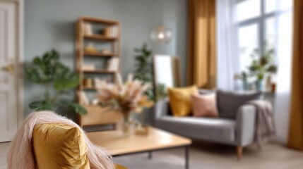 A cozy living room featuring a stylish couch, warm colors, decorative plants, and a modern bookshelf, creating an inviting atmosphere.