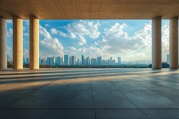 Panoramic view of a modern city skyline seen from a spacious open terrace framed by large stone columns under a partly cloudy sky during daylight