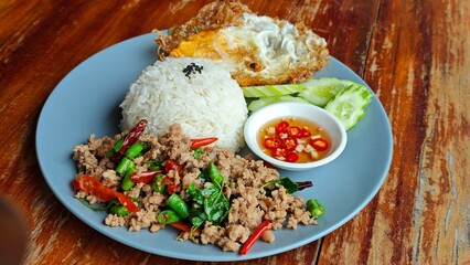 Stir fry pork with holy basil.