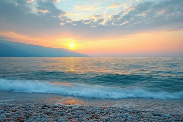 Serene pebble beach at sunrise with gentle turquoise waves, glowing sun above distant mountains and soft pastel clouded sky