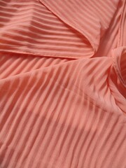 background and pattern of plain pink fabric with striped motif