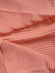 background and pattern of plain pink fabric with striped motif