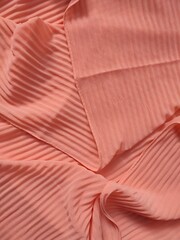 background and pattern of plain pink fabric with striped motif