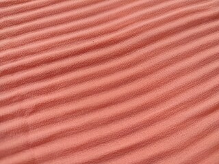 background and pattern of plain pink fabric with striped motif