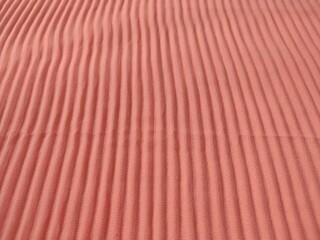 background and pattern of plain pink fabric with striped motif