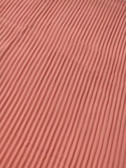 background and pattern of plain pink fabric with striped motif