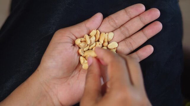 Peanuts are carefully sorted by hand in this activity
