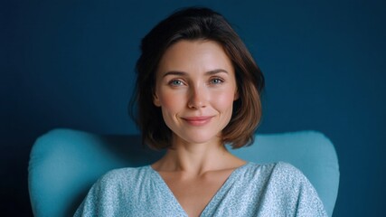 Smile woman portrait blue chair home happiness concept calm natural expression warms cozy room with gentle light and soft mood