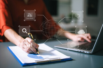 Businesswoman uses a tablet to analyze data on a virtual interface, symbolizing business innovation, technology, and global connection