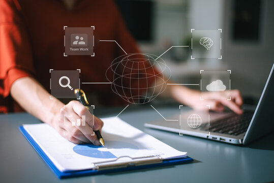 Businesswoman uses a tablet to analyze data on a virtual interface, symbolizing business innovation, technology, and global connection