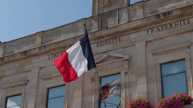 French Flag Waving on Historic Town Hall in Dunkirk