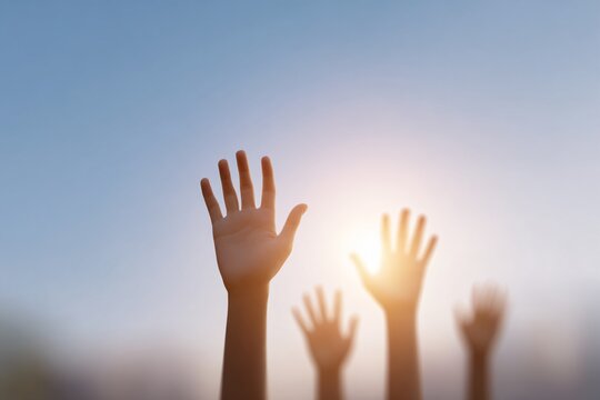 Uplifting gesture of hope hands reaching upward in soft daylight outdoor setting inspirational viewpoint
