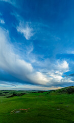 Sunset views over rural farmland with beautiful cloud formations